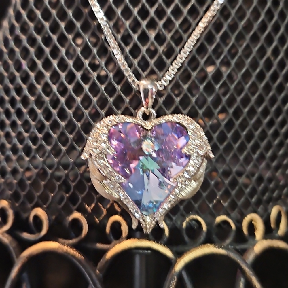 Elegant Silver Heart Wing Necklace with Bluish Purple Gemstone